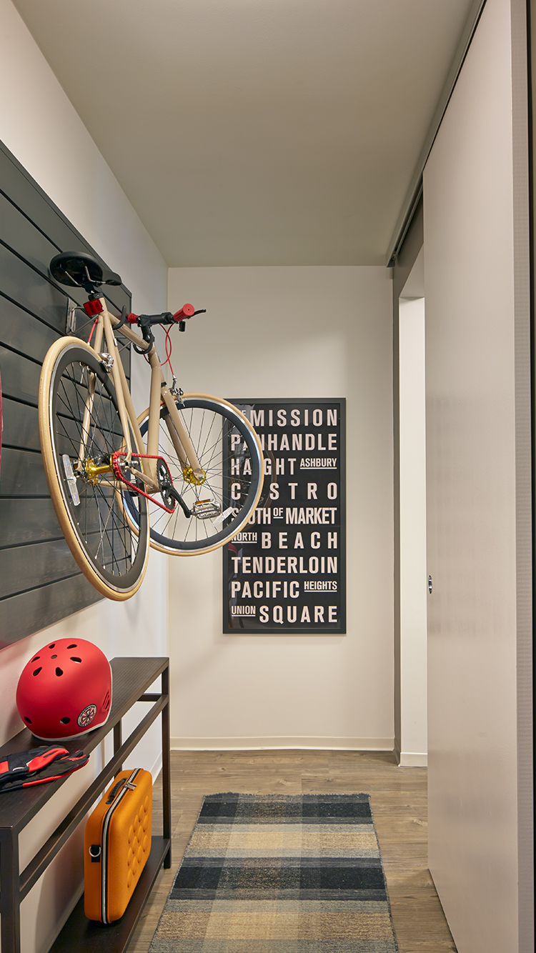 Bedroom with customizable gear wall and hard surface flooring