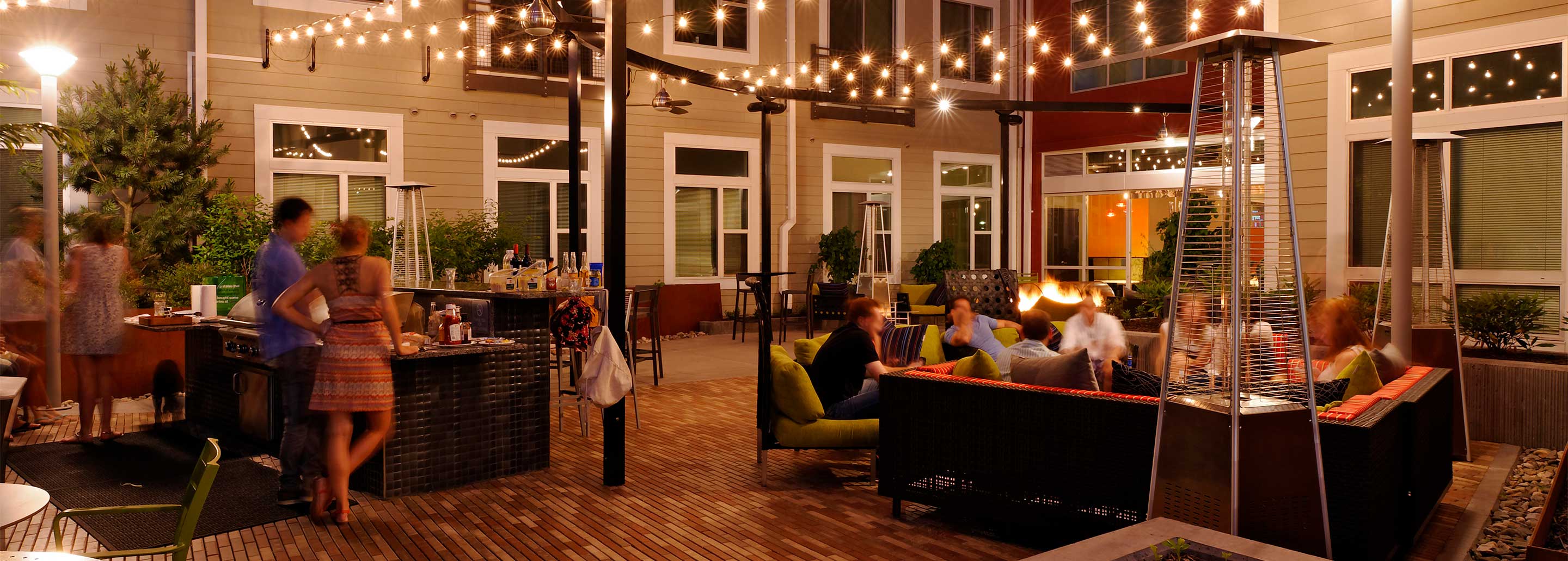 Outdoor chill lounge with fireplace, heat lamps and lounge seating