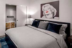 Furnished bedroom with wall décor